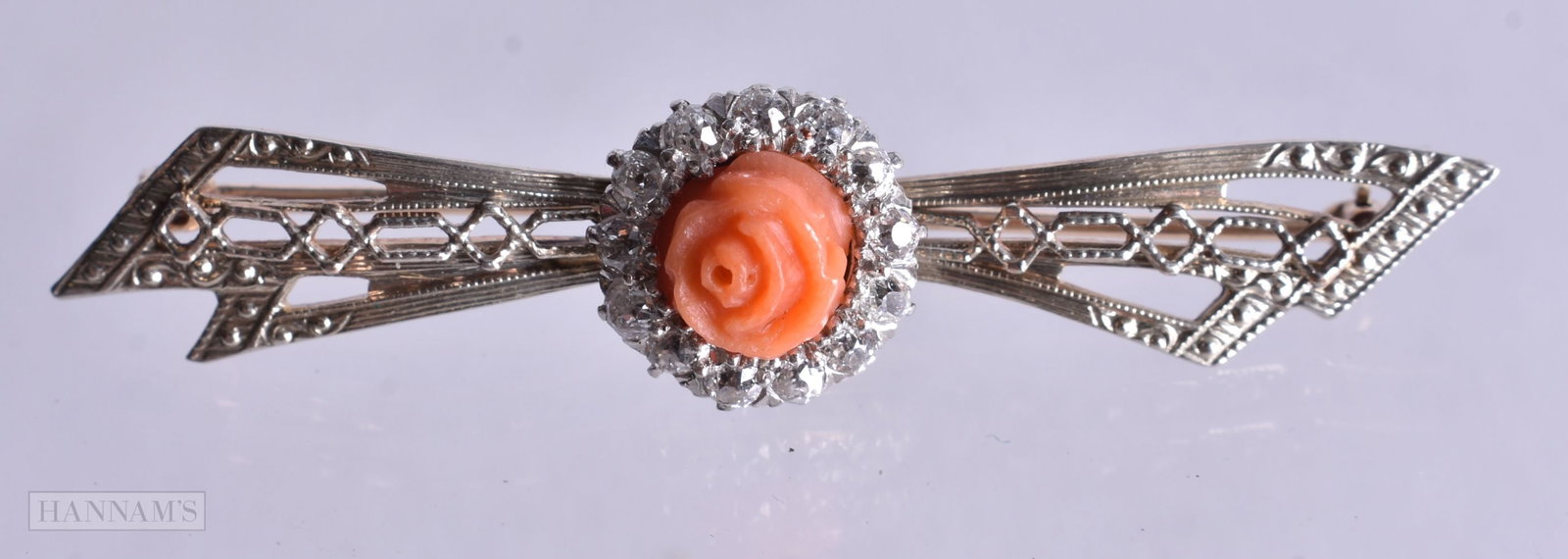 A 10 Carat Gold, Coral and Diamond Brooch. Stamped 10K, 2cm x 1.5cm, weight 5g: A 10 Carat Gold, Coral and Diamond Brooch. Stamped 10K, 2cm x 1.5cm, weight 5g