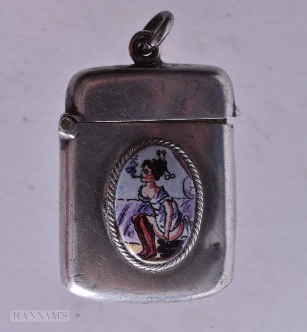 A Silver Fob Vesta with an Enamel Cabochon of a Lady Smoking a Pipe. Hallmarked Birmingham 1903, 4. (1 of 4)
