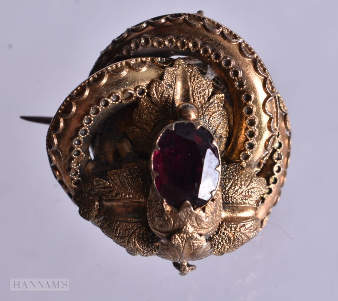 A Victorian High Carat Gold and Garnet Brooch. Unmarked. 2.3cm x 2.3cm, weight 4.8g (1 of 3)