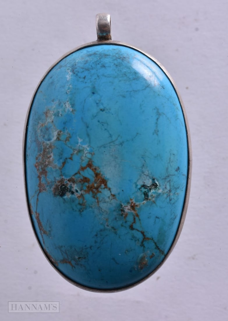 A Turquoise Pendant. 5.7cm x 3.5cm, weight 26.9g: A Turquoise Pendant. 5.7cm x 3.5cm, weight 26.9g