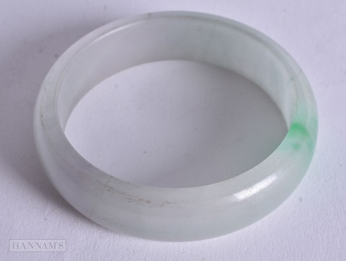 A Jade Bangle. Internal 6cm diameter, weight 63.6g (1 of 2)
