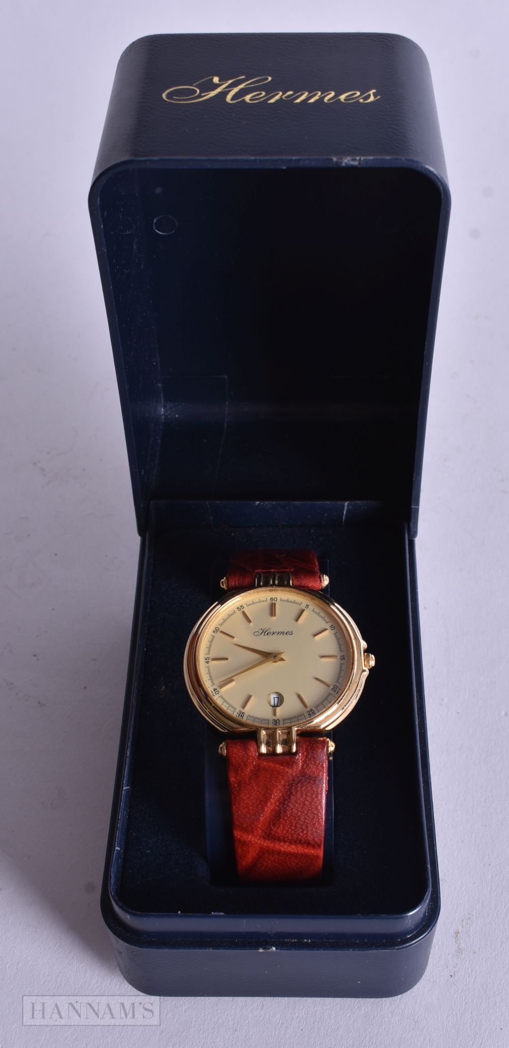 A Boxed Vintage Hermes Watch with a Gold Dial and Red Textured Leather Strap. Not working: A Boxed Vintage Hermes Watch with a Gold Dial and Red Textured Leather Strap. Not working