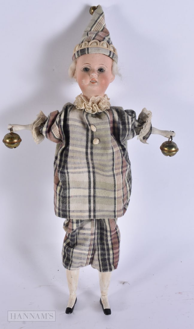 A VICTORIAN AUTOMATON BELL DOLL. 35 cm long.: A VICTORIAN AUTOMATON BELL DOLL. 35 cm long.