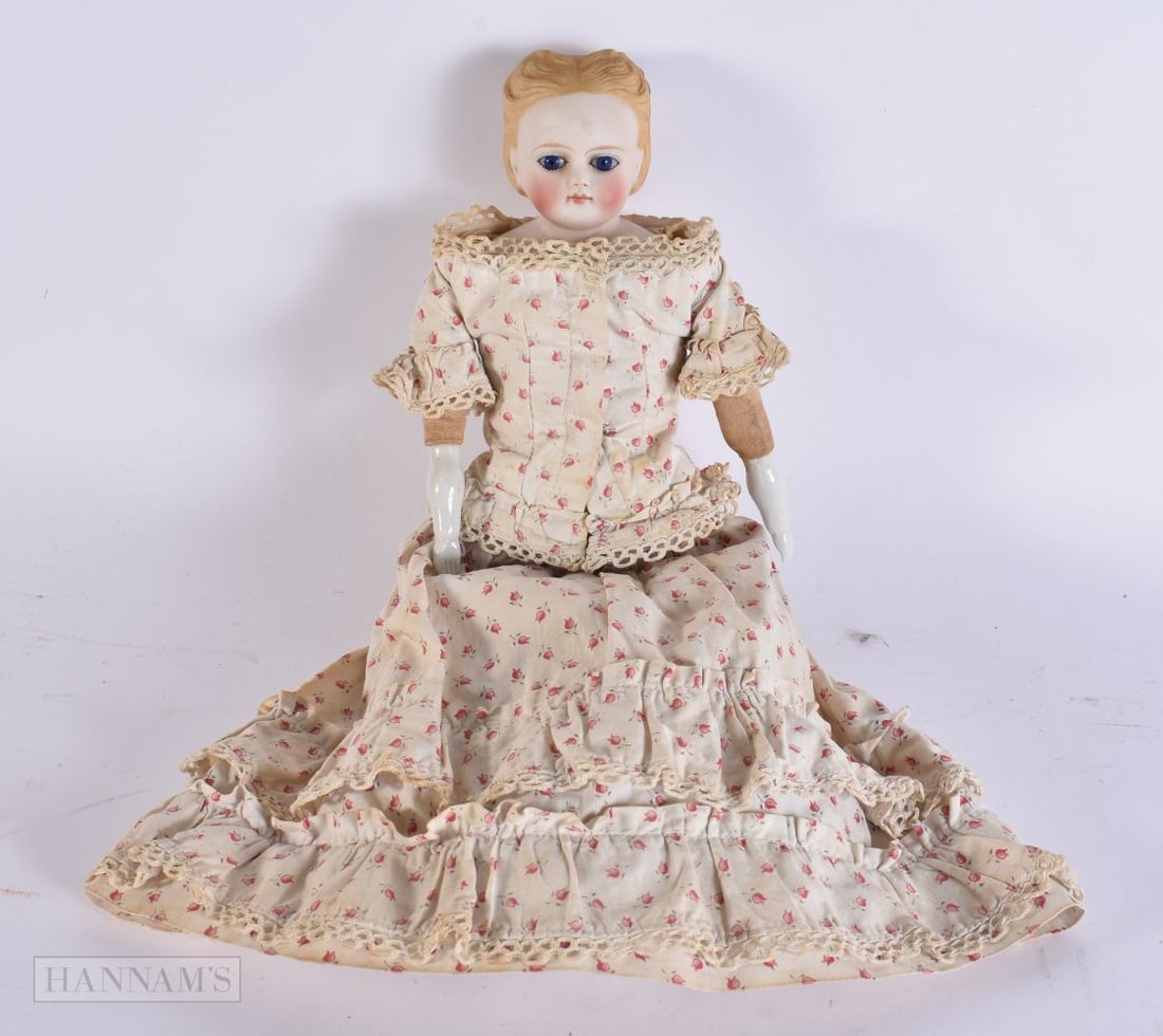 A VICTORIAN BISQUE HEADED DOLL. 38 cm long. (1 of 4)