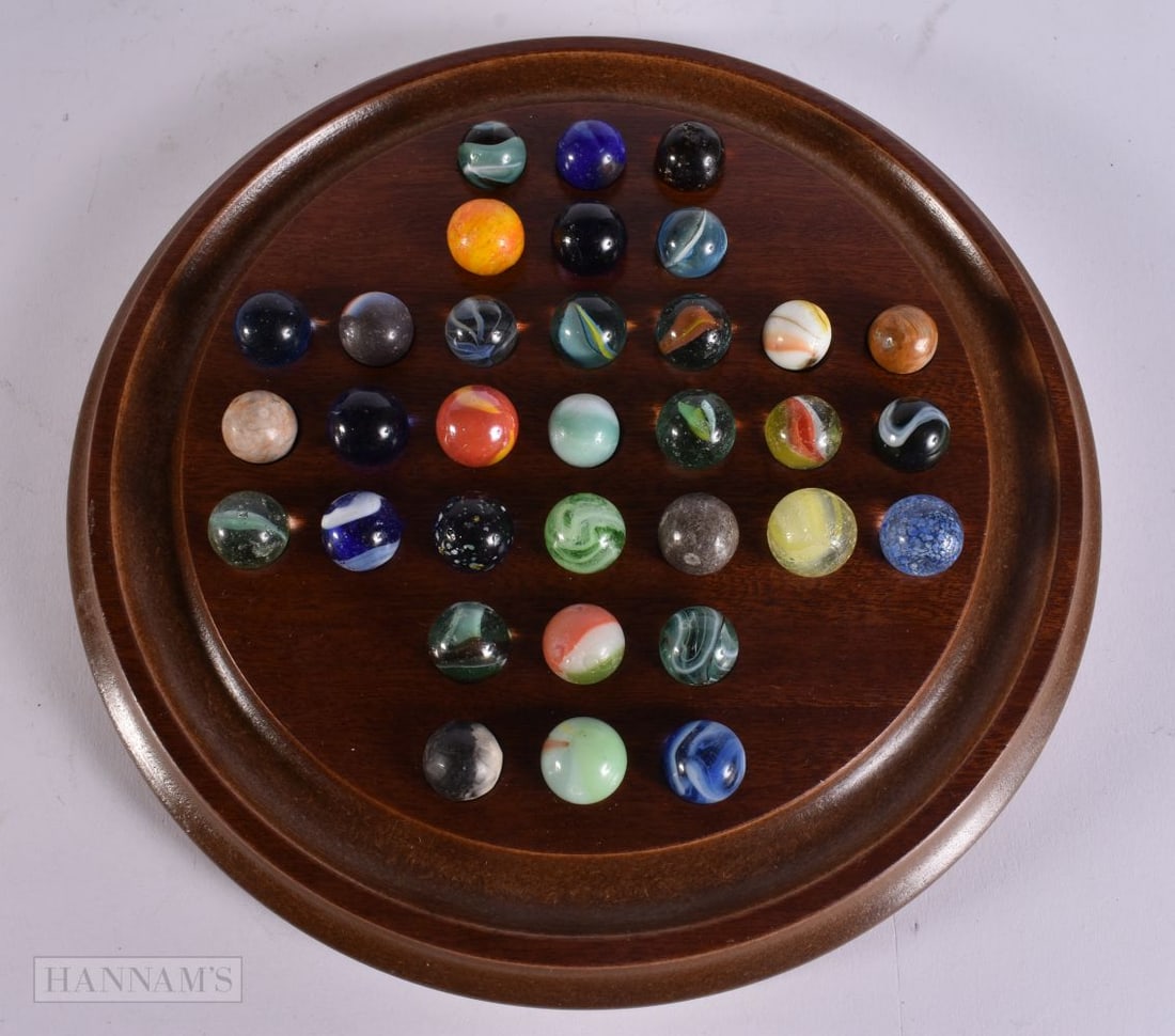 A SOLITAIRE MARBLE BOARD with marbles. (qty) (1 of 4)