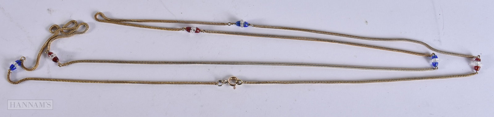 A YELLOW METAL GEM SET CHAIN. 135 cm long. (1 of 4)