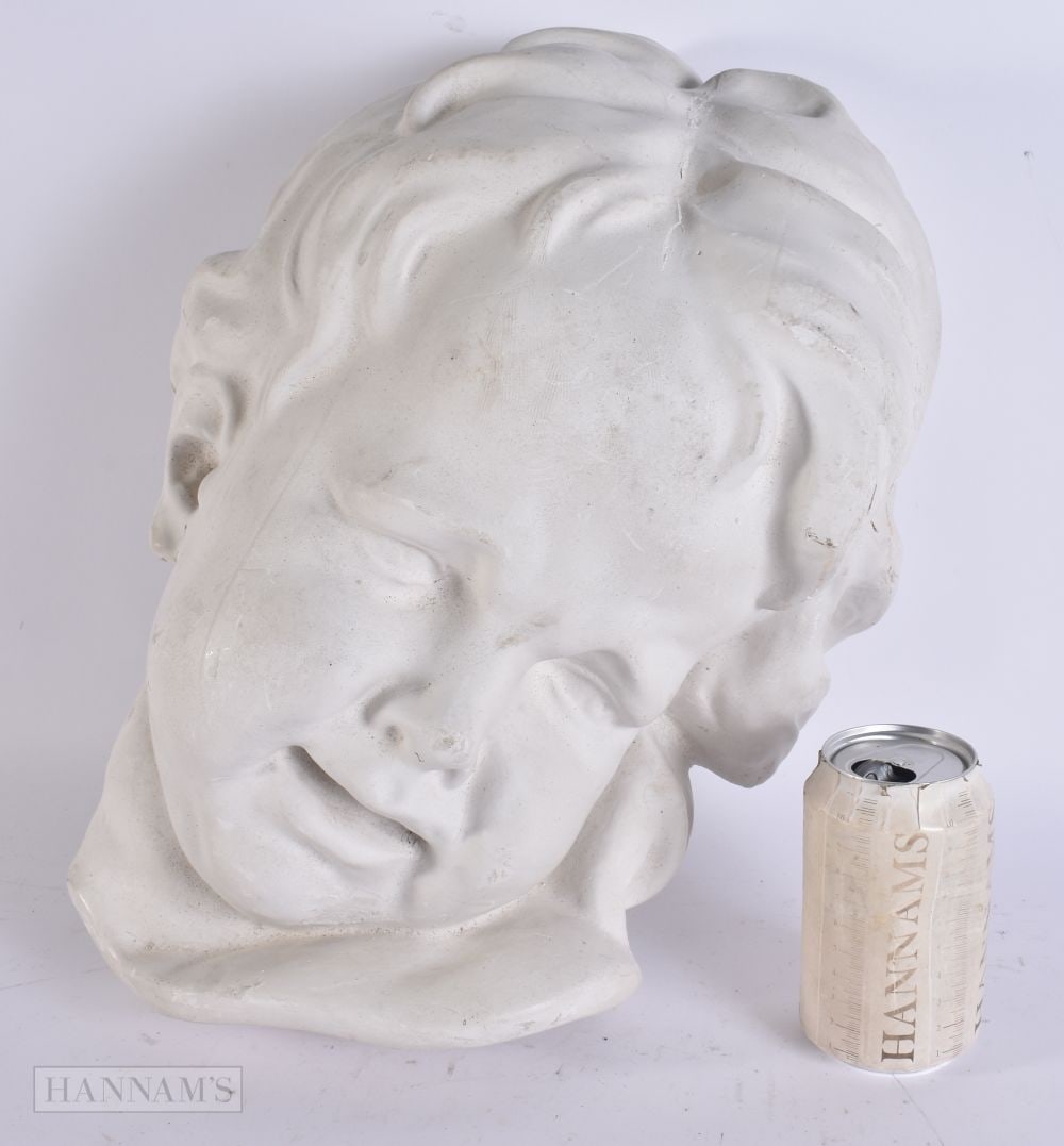 A LARGE PLASTER HEAD OF A CHILD. 40 cm x 22 cm. (1 of 5)