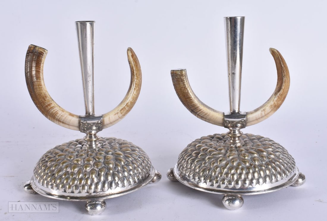A PAIR OF VICTORIAN SILVER PLATED CANDLESTICKS with solid silver caps. 13 cm high. (1 of 5)