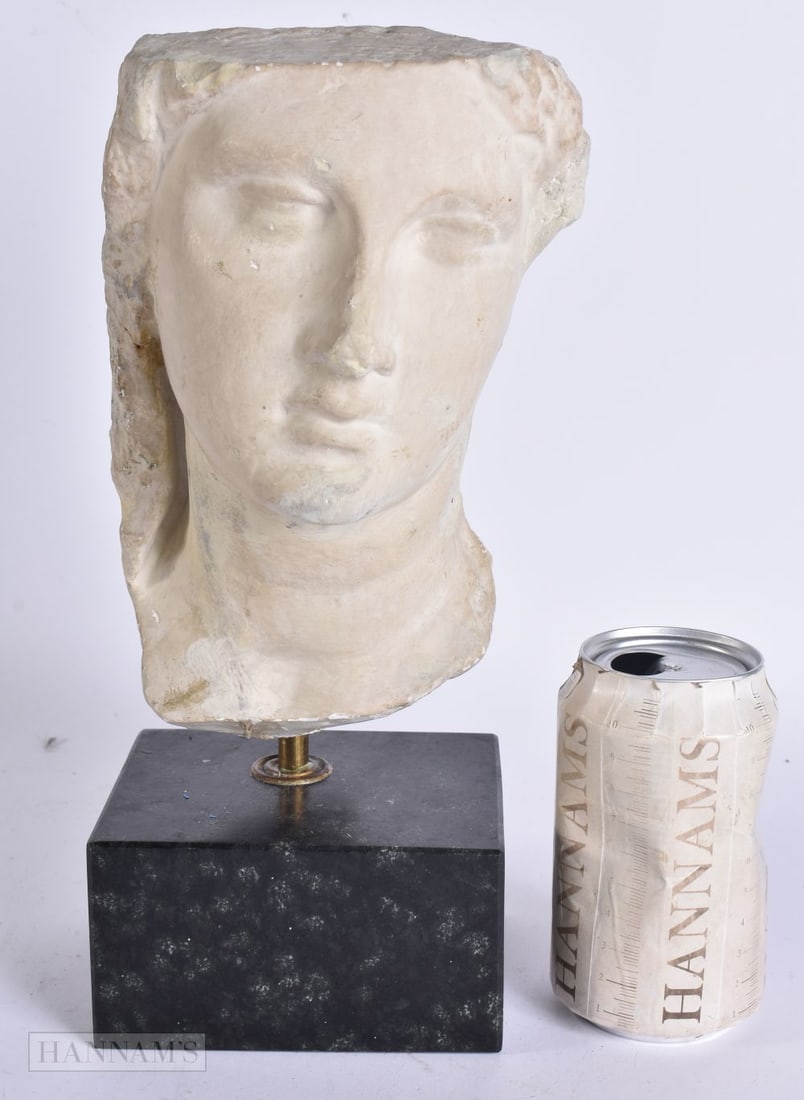 A PLASTER BUST OF A FEMALE After the Antiquity. 29 cm high. (1 of 4)