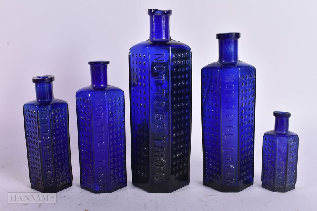FIVE VICTORIAN HOBNAIL CUT COFFIN SHAPED GLASS BOTTLES. Largest 16 cm high. (5) (1 of 4)