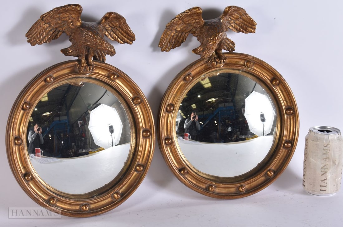 A RARE PAIR OF REGENCY CONVEX GILTWOOD EAGLE MIRRORS. 32 cm x 26 cm. (1 of 5)