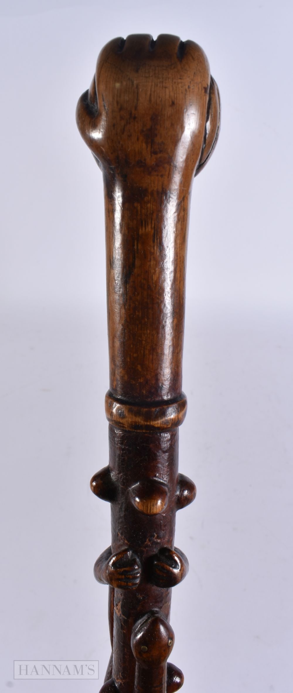 AN ANTIQUE FOLK ART WOOD SNAKE WALKING CANE with fist terminal. 94 cm long. (1 of 6)
