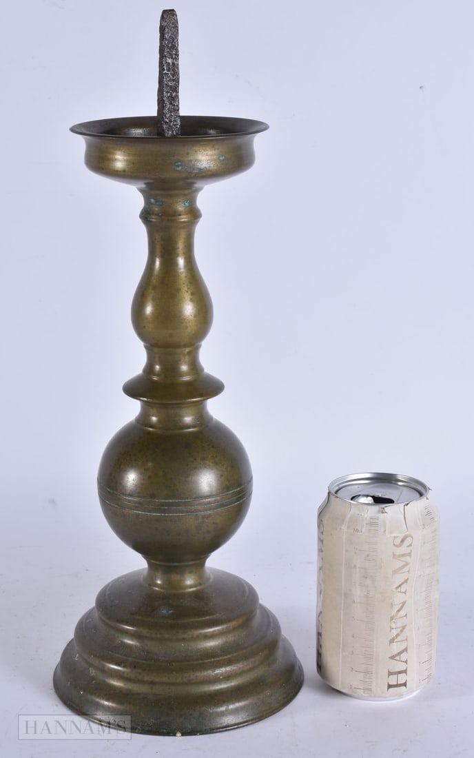 A 17TH CENTURY DUTCH BRONZE PRICKET CANDLESTICK with iron pricket. 36.5 cm high. (1 of 4)