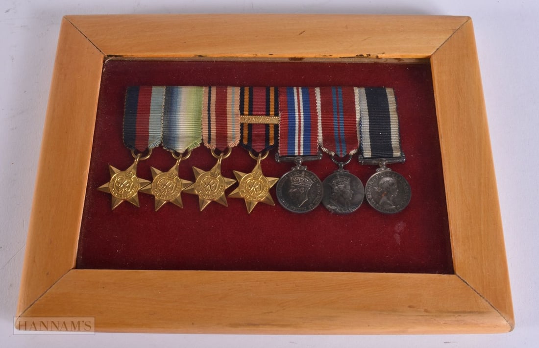 A FRAMED SET OF MINIATURE MEDALS. 18.5 cm x 14.5 cm. (1 of 4)