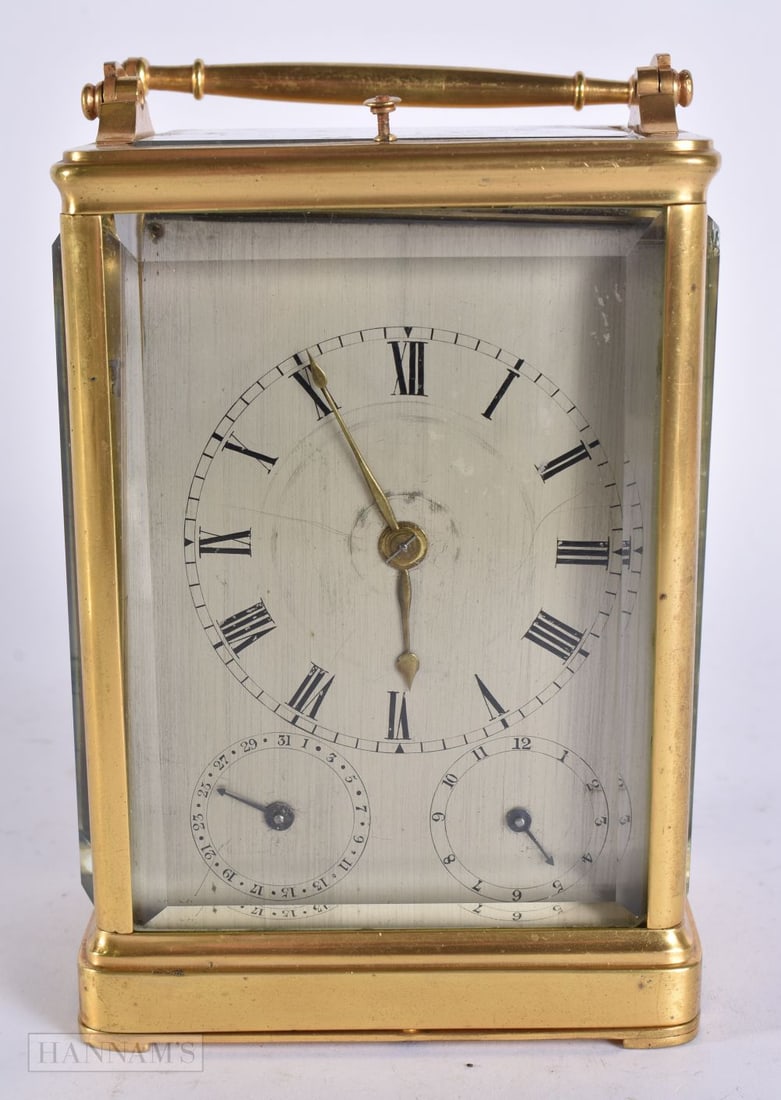 AN ANTIQUE FRENCH BRASS REPEATING CARRIAGE CLOCK with silvered dial. 18 cm high inc handle. (1 of 6)
