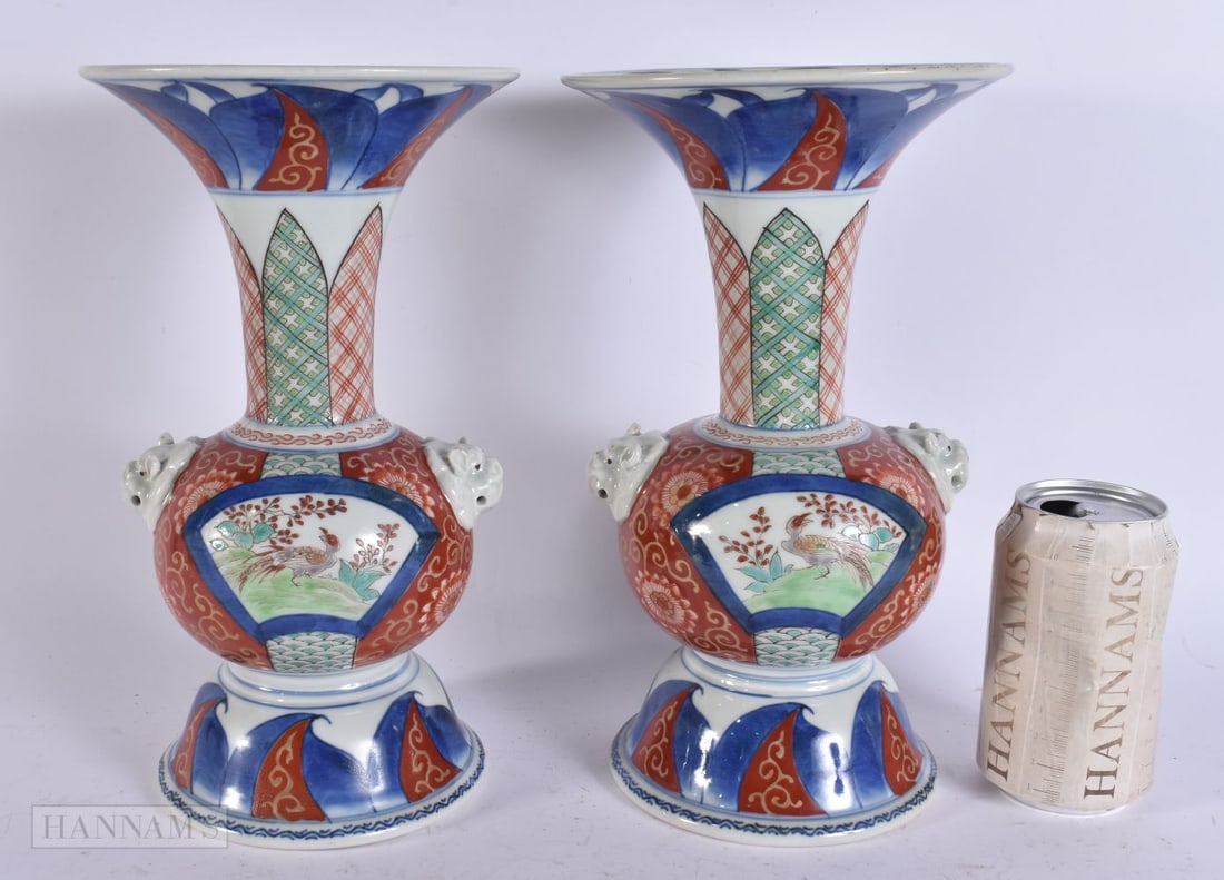 A PAIR OF 19TH CENTURY JAPANESE MEIJI PERIOD IMARI FLARED PORCELAIN VASES painted with birds and flo: A PAIR OF 19TH CENTURY JAPANESE MEIJI PERIOD IMARI FLARED PORCELAIN VASES painted with birds and flowers. 26.5 cm high.