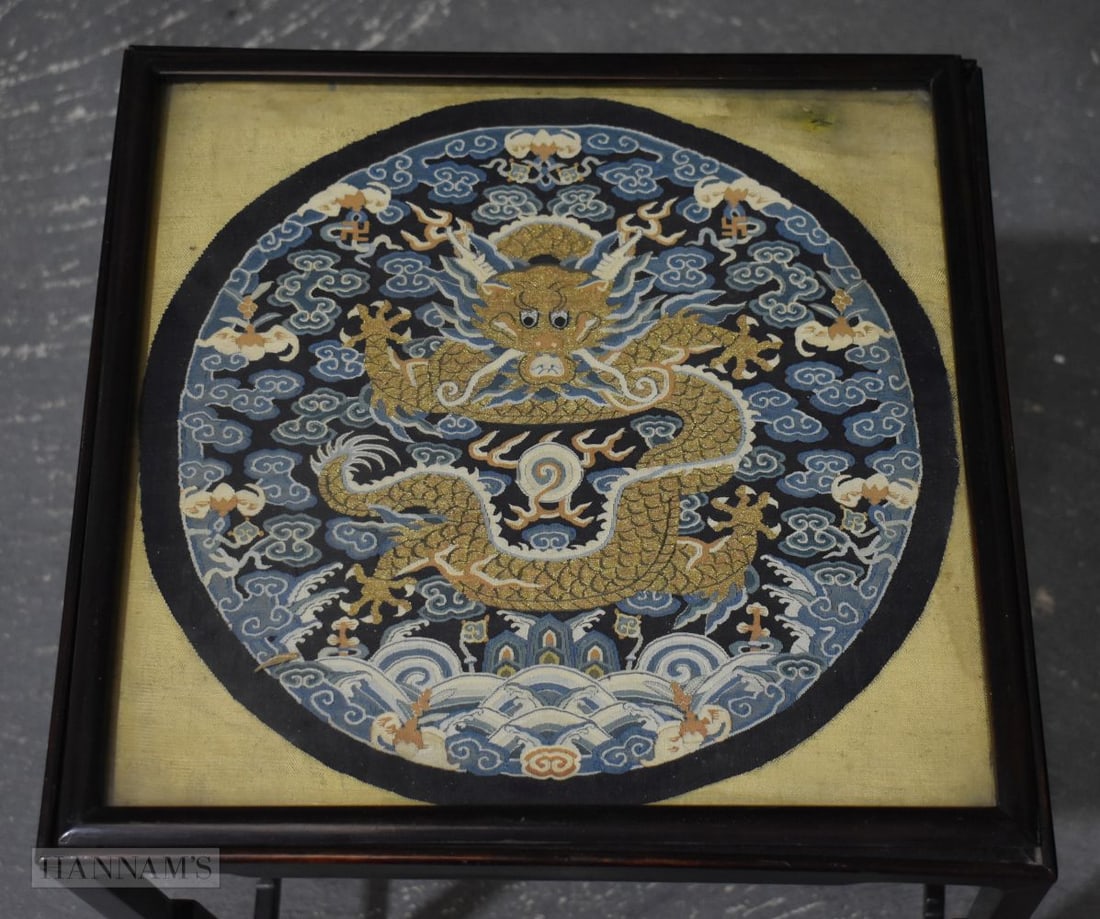 AN 18TH CENTURY CHINESE KESI SILK DRAGON ROUNDEL Qing, inset within a hardwood table. 48 cm x 36 cm. (1 of 9)