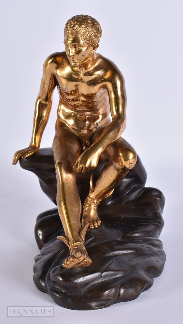 A FINE 19TH CENTURY GRAND TOUR GILT BRONZE FIGURE OF THE SEATED MERCURY modelled upon a bronze rocky: A FINE 19TH CENTURY GRAND TOUR GILT BRONZE FIGURE OF THE SEATED MERCURY modelled upon a bronze rocky outcrop. 18 cm x 15 cm.