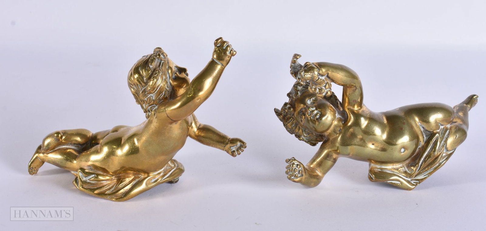 A PAIR OF 19TH CENTURY BRONZE PUTTI. 15 cm wide. (1 of 7)