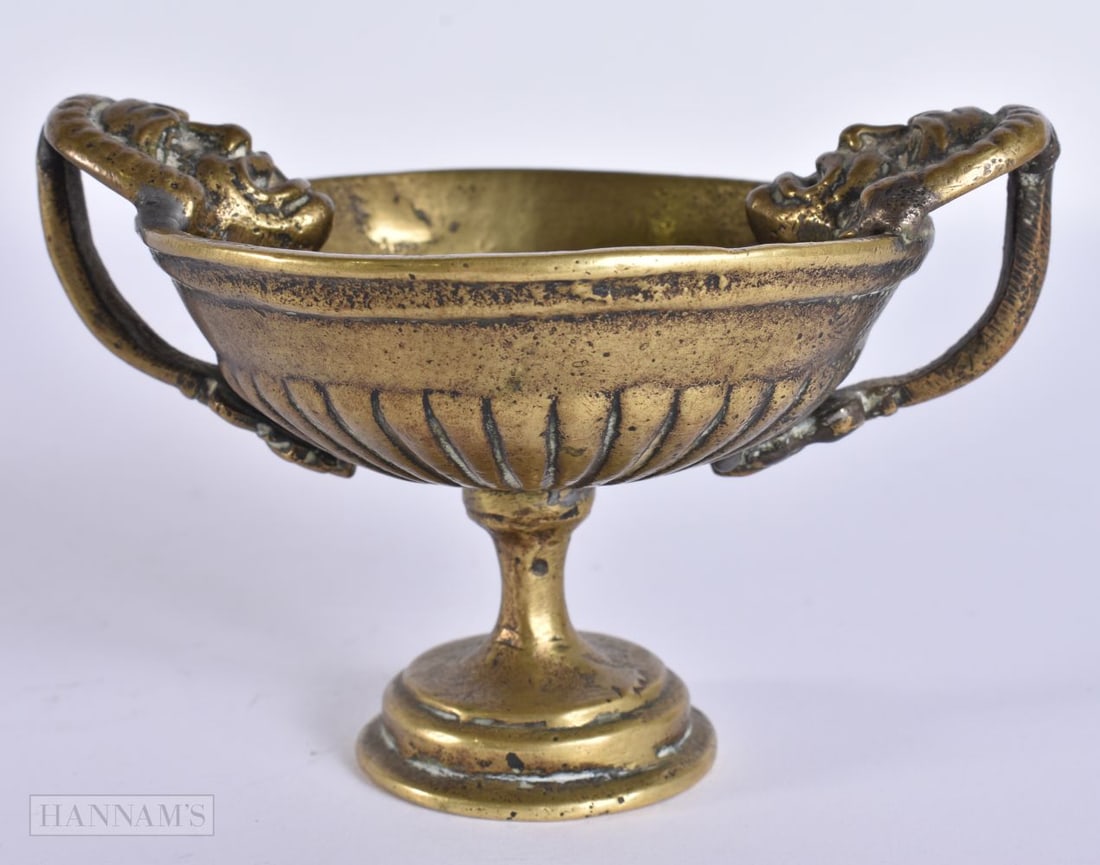 AN UNUSUAL 17TH/18TH CENTURY BRONZE TWIN HANDLED MASK HEAD CUP. 11.5 cm wide. (1 of 5)