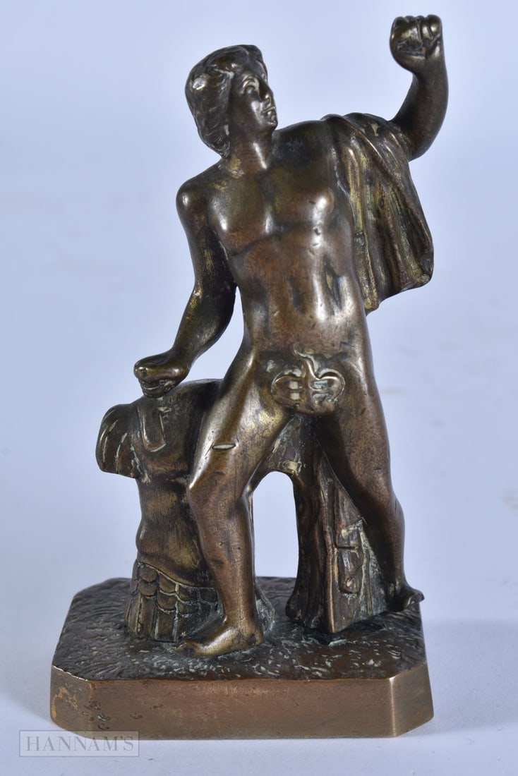 AN 18TH/19TH CENTURY GRAND TOUR BRONZE FIGURE OF A MALE modelled with one arm raised. 10.75 cm x 5 c: AN 18TH/19TH CENTURY GRAND TOUR BRONZE FIGURE OF A MALE modelled with one arm raised. 10.75 cm x 5 cm.