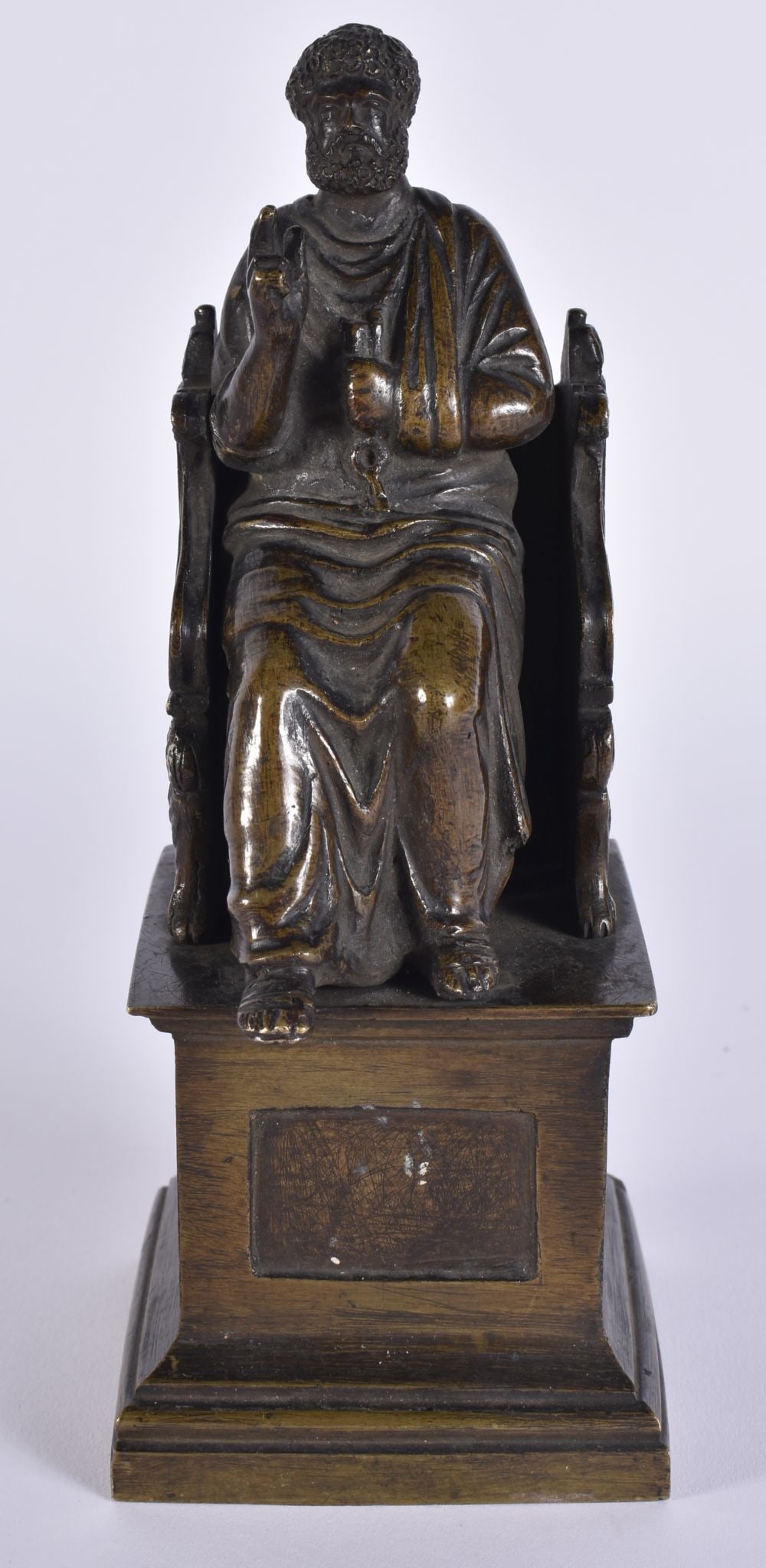 AN 18TH/19TH CENTURY GRAND TOUR BRONZE FIGURE OF A SAINT modelled upon a chair. 18 cm high.: AN 18TH/19TH CENTURY GRAND TOUR BRONZE FIGURE OF A SAINT modelled upon a chair. 18 cm high.