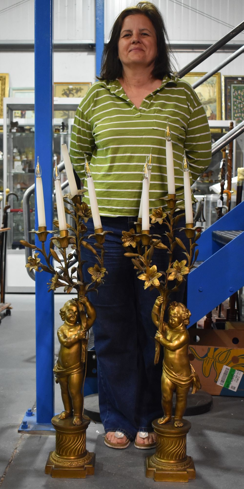 A FINE AND MONUMENTAL PAIR OF 19TH CENTURY FRENCH GILT BRONZE CANDLESTICK LAMPS formed with standing (1 of 8)