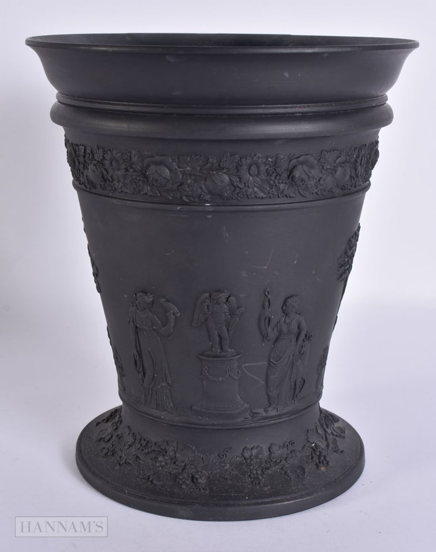 A WEDGWOOD BLACK BASALT VASE decorated with classical figures. 17.5 cm x 15 cm.: A WEDGWOOD BLACK BASALT VASE decorated with classical figures. 17.5 cm x 15 cm.