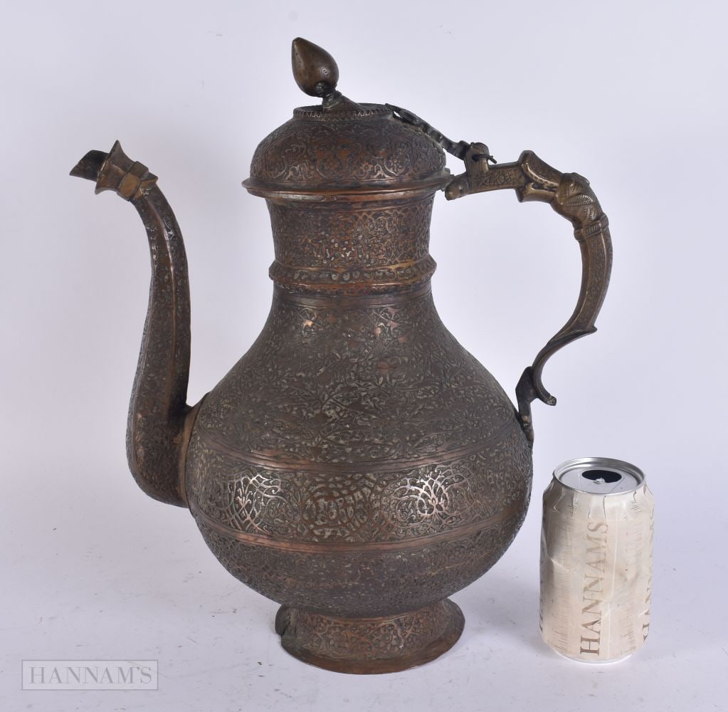 AN ANTIQUE ISLAMIC BRONZE EWER. 38 cm x 20cm. (1 of 8)