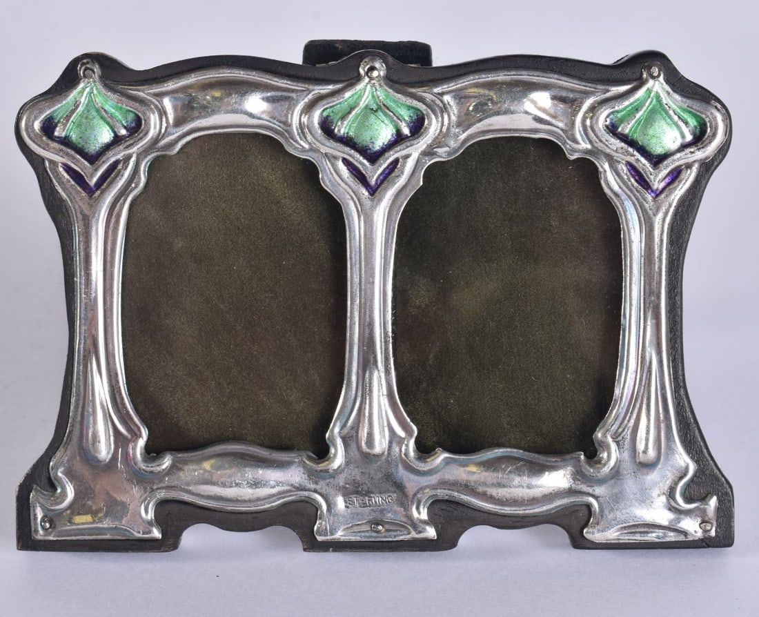 A SILVER AND ENAMEL FRAME. 11.25cm x 8 cm. (1 of 3)