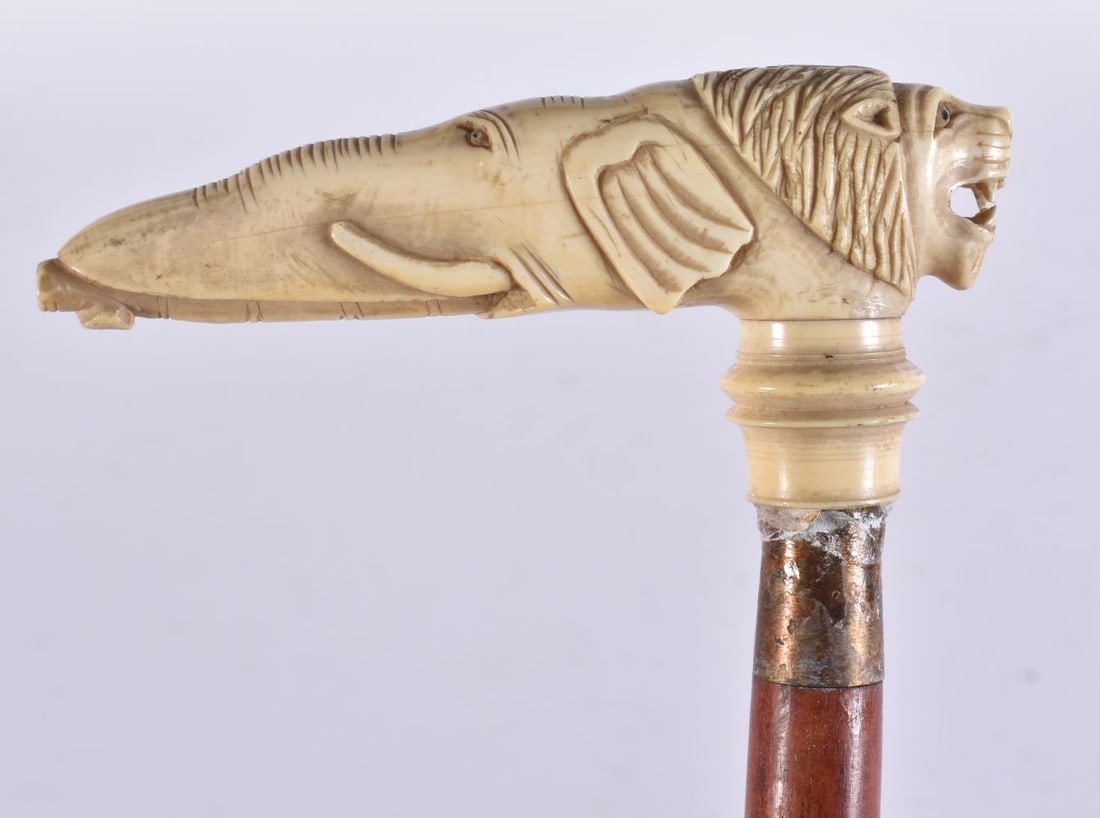 A RARE 19TH CENTURY ELEPHANT AND LION WALKING CANE. 87 cm long. (1 of 4)