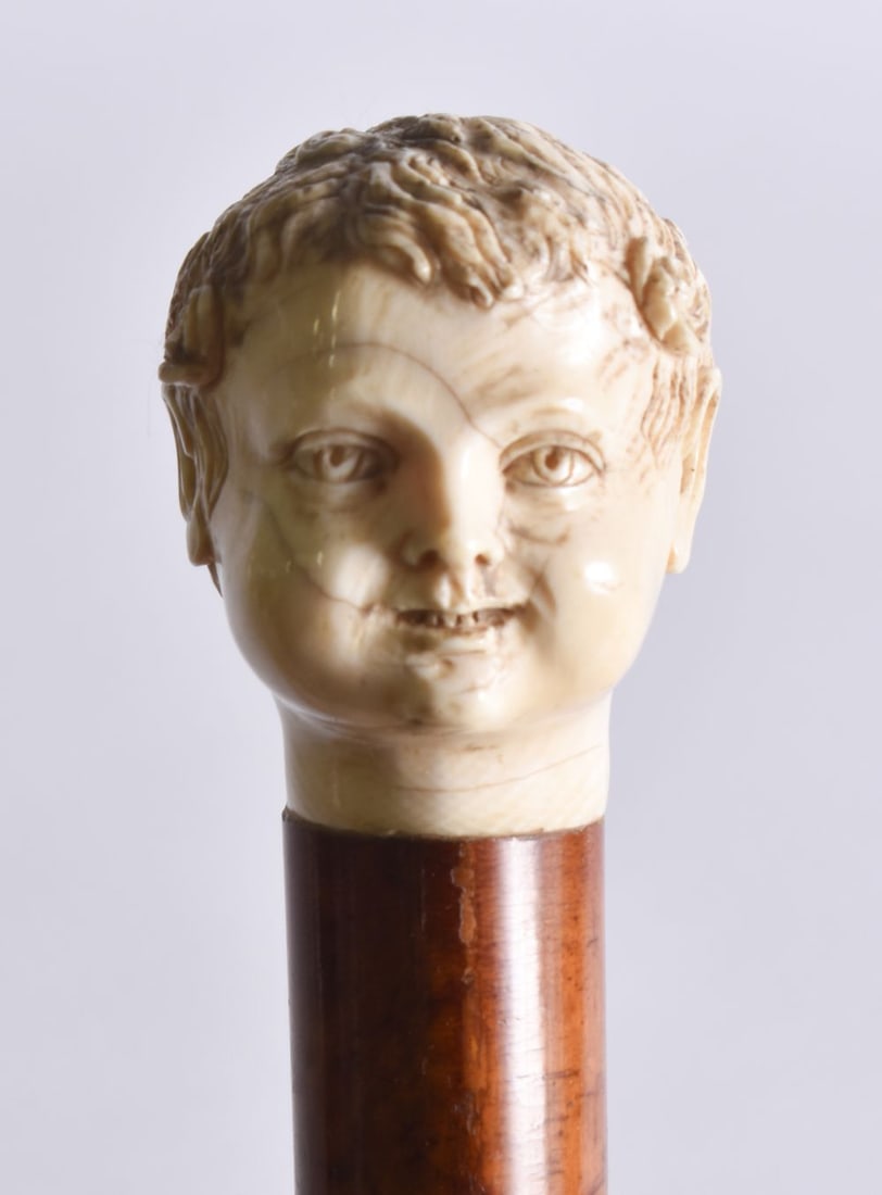 AN UNUSUAL 19TH CENTURY SMILING CHILD WALKING CANE. 86 cm long. (1 of 5)