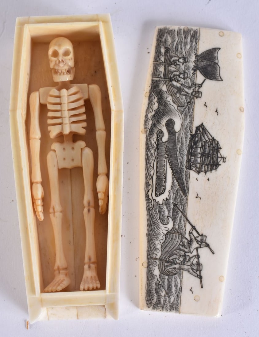 A SCRIMSHAW BONE COFFIN. 11.5 cm x 4.25cm. (1 of 5)