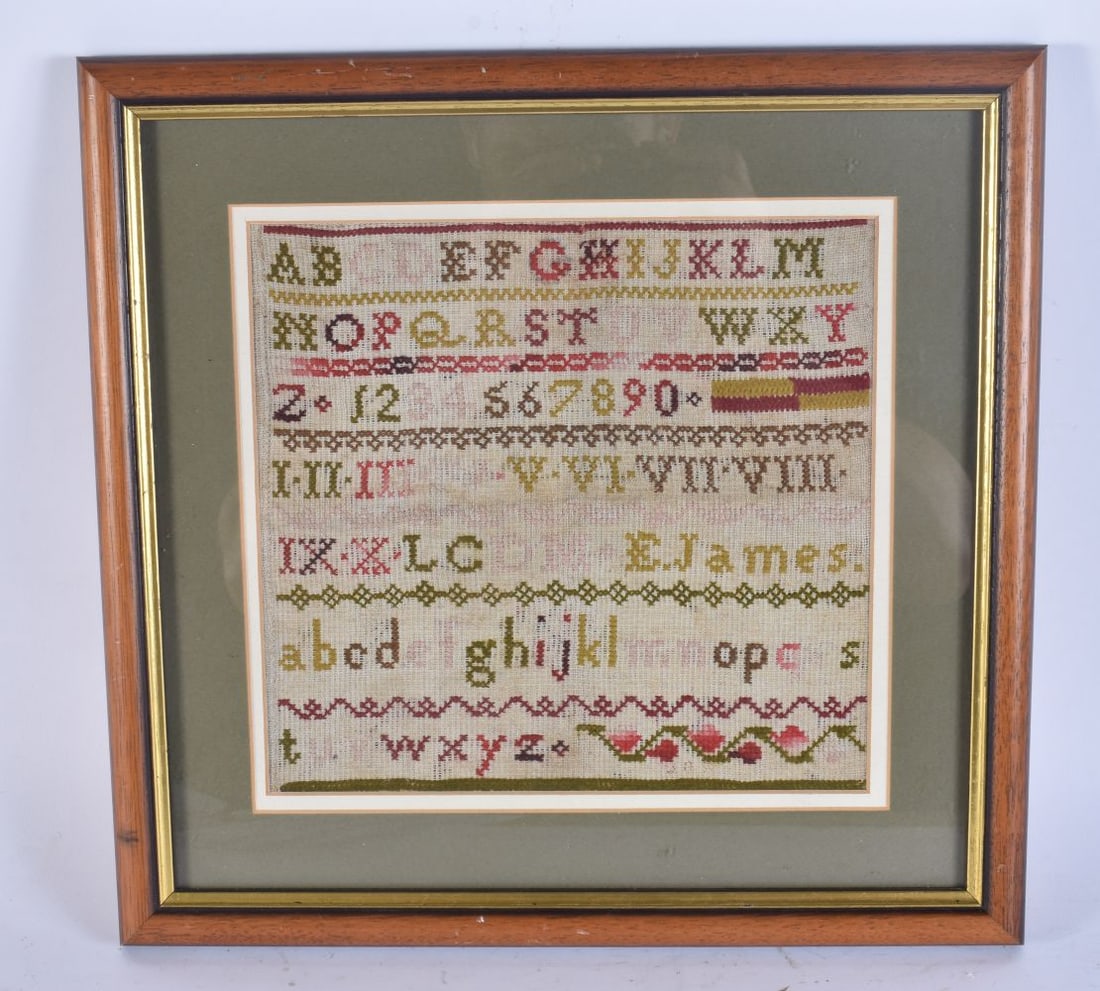 AN ANTIQUE SAMPLER. 34 cm square. (1 of 4)