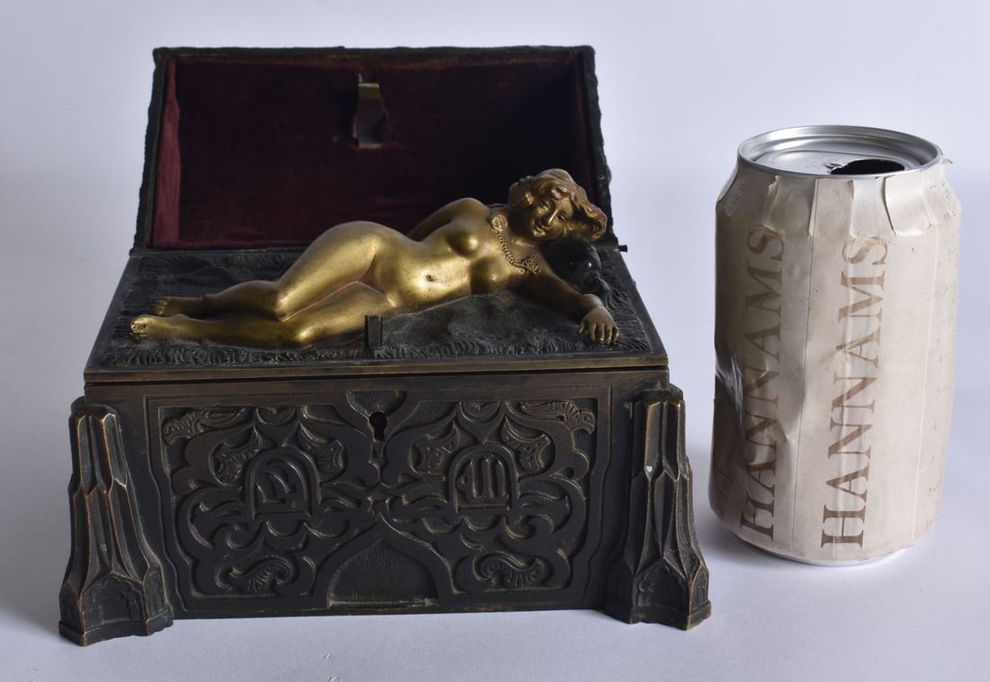 A RARE 19TH CENTURY AUSTRIAN BRONZE EROTIC JEWELLERY CASKET formed with a well chased outer body, re: A RARE 19TH CENTURY AUSTRIAN BRONZE EROTIC JEWELLERY CASKET formed with a well chased outer body, revealing a nude female to the interior. 16 cm x 10 cm x 14 cm.