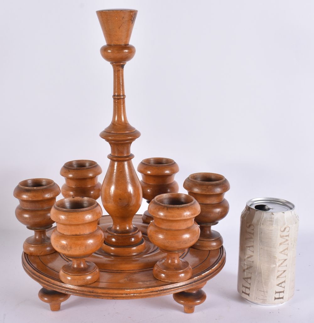 AN ANTIQUE CARVED WOOD EGG CUP STAND. 33 cm x 15 cm. (1 of 4)