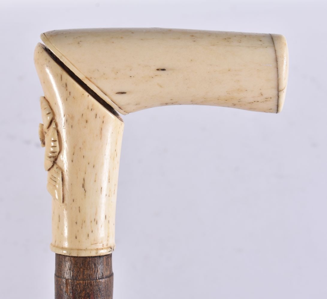 A VICTORIAN BONE WALKING CANE. 88 cm long. (1 of 5)