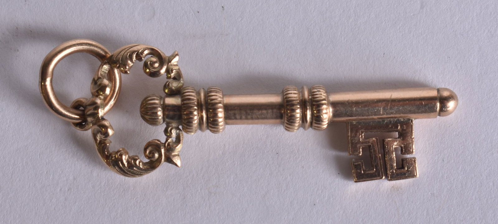 A 9CT GOLD KEY PENDANT. 4.8 grams. 5 cm x 1.5 cm. (1 of 3)