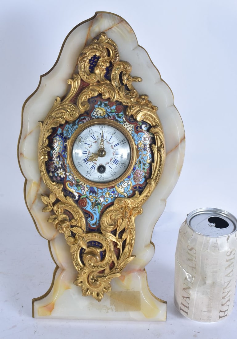 A 19TH CENTURY FRENCH ORMOLU ONYX AND CHAMPLEVE ENAMEL STRUT CLOCK. 30cm x 15 cm. (1 of 6)