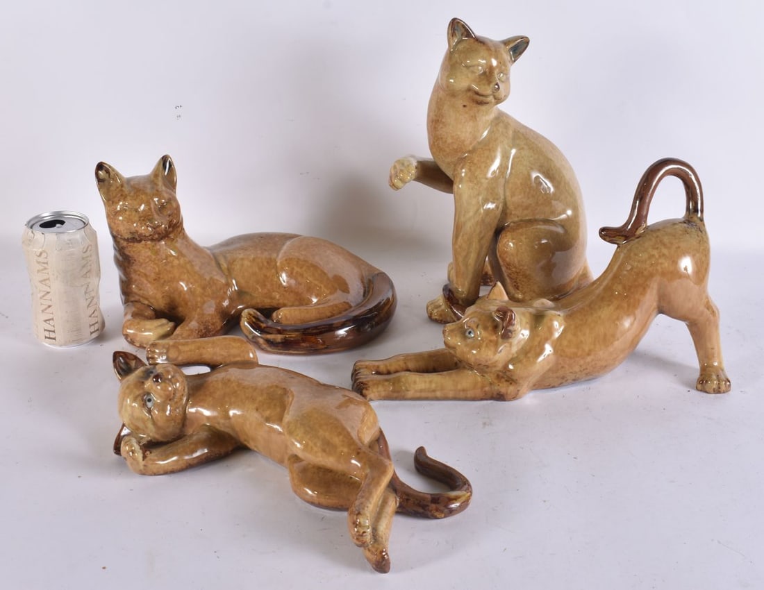 FOUR POTTERY CATS. Largest 30cm wide. (4) (1 of 6)