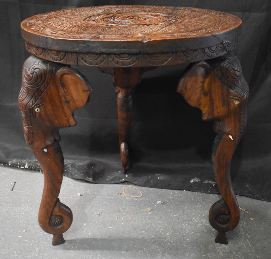 AN EARLY 20TH CENTURY ANGLO INDIAN CARVED WOOD ELEPHANT STAND. 52cm x 50cm (1 of 5)
