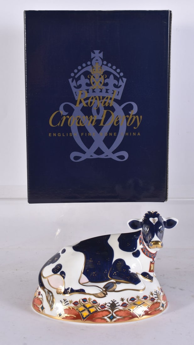 A ROYAL CROWN DERBY PORCELAIN COW PAPERWEIGHT. 16 cm x 14 cm. (1 of 3)