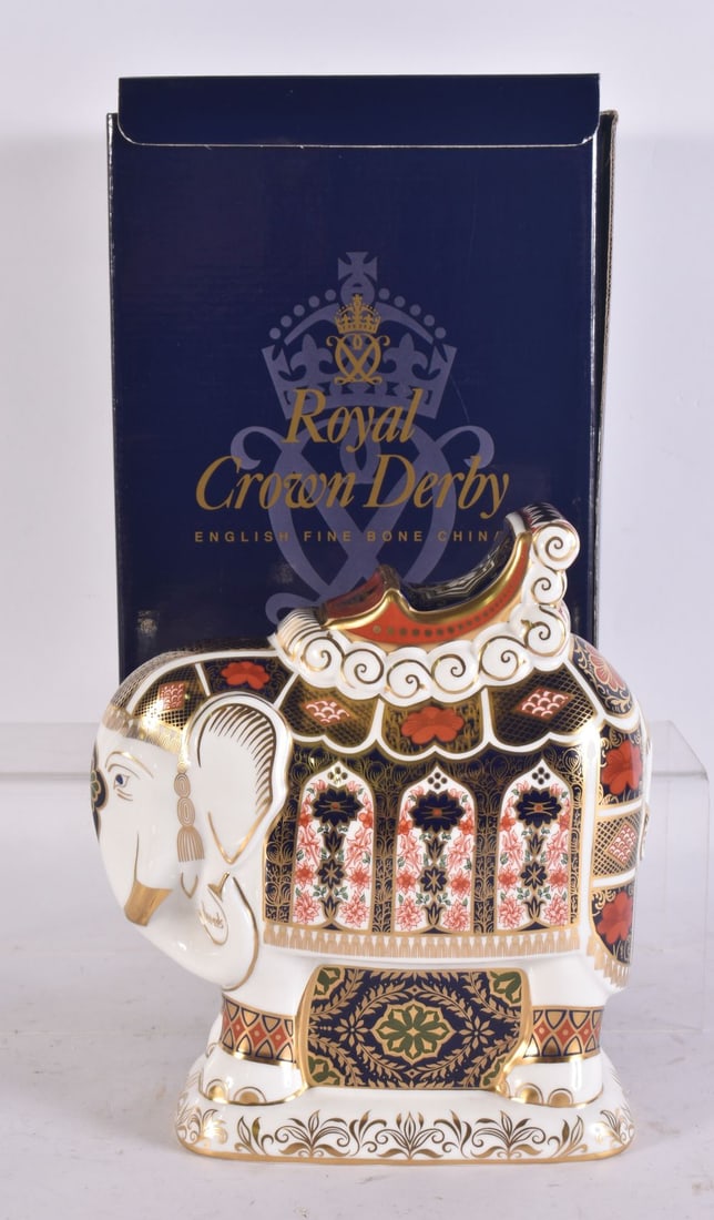A ROYAL CROWN DERBY ELEPHANT PAPERWEIGHT. 18 cm high. (1 of 3)