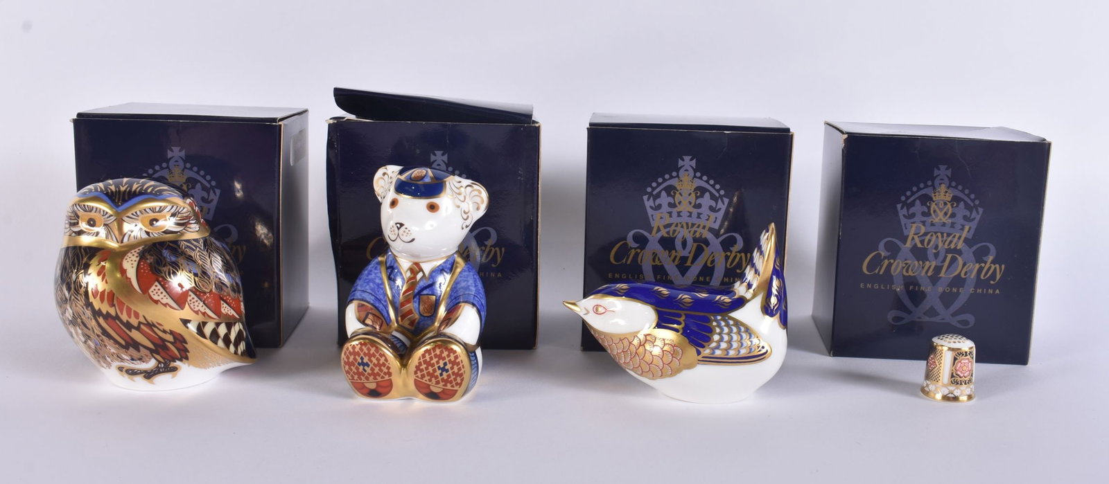 FOUR ROYAL CROWN DERBY PORCELAIN PAPERWEIGHTS including Schoolboy, Wren etc. (4) (1 of 3)