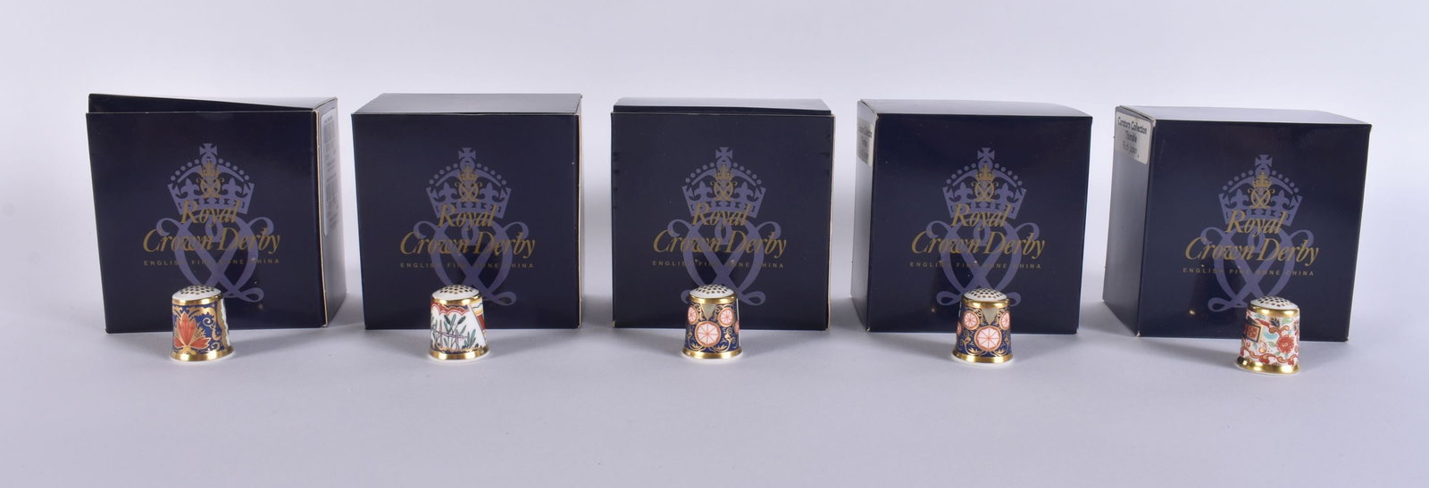 FIVE ROYAL CROWN DERBY PORCELAIN THIMBLES. (5): FIVE ROYAL CROWN DERBY PORCELAIN THIMBLES. (5)