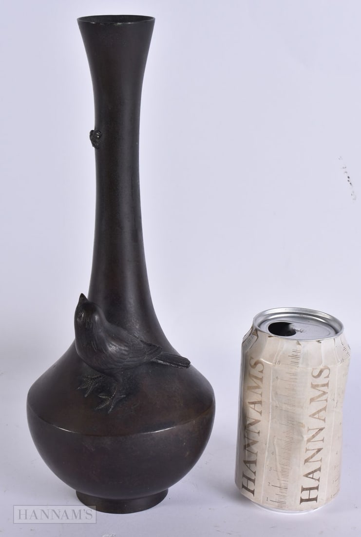 A 19TH CENTURY JAPANESE MEIJI PERIOD BRONZE VASE overlaid with a bird and bug. 29 cm high.: A 19TH CENTURY JAPANESE MEIJI PERIOD BRONZE VASE overlaid with a bird and bug. 29 cm high.
