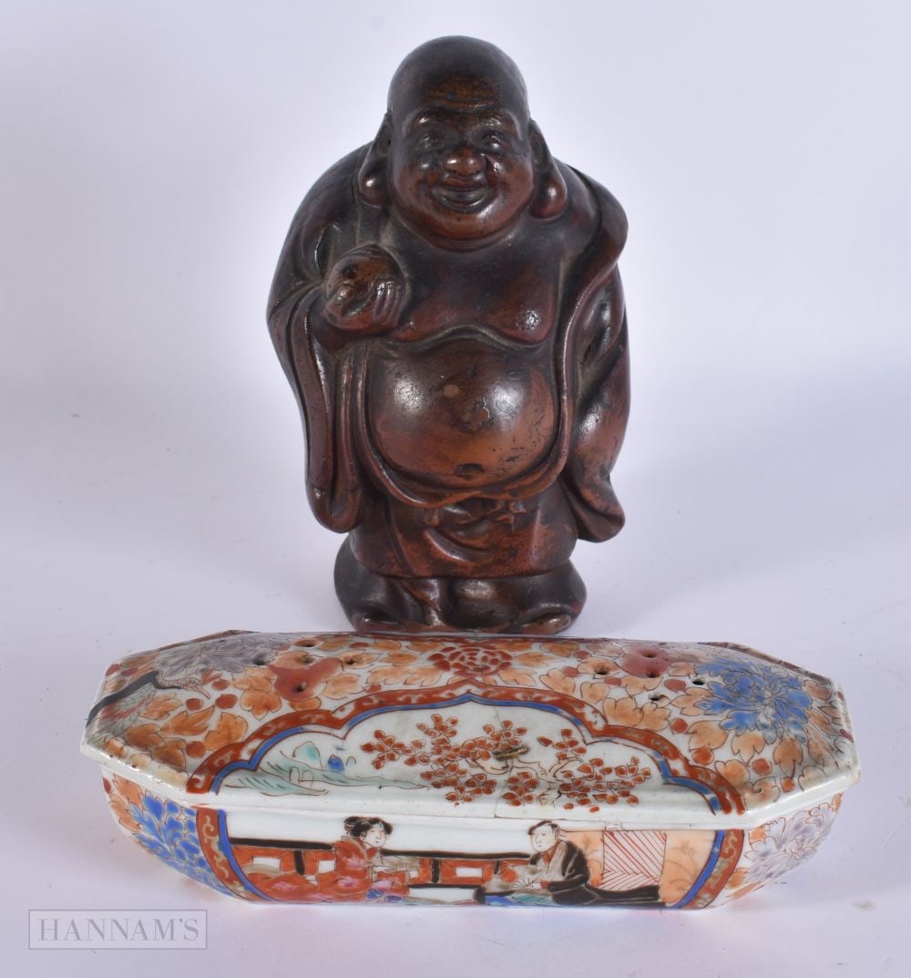 AN EARLY 20TH CENTURY JAPANESE MEIJI PERIOD POTTERY BUDDHA together with a Kutani box and cover. Lar: AN EARLY 20TH CENTURY JAPANESE MEIJI PERIOD POTTERY BUDDHA together with a Kutani box and cover. Largest 18 cm wide. (2)