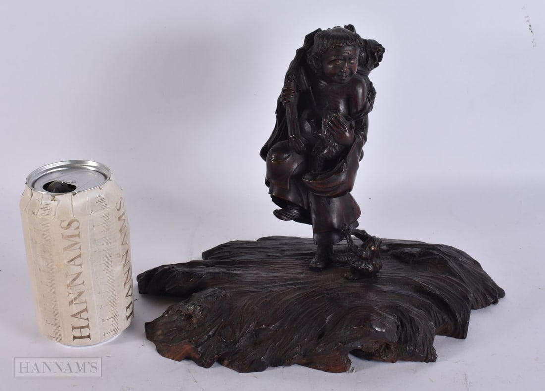 A 19TH CENTURY JAPANESE MEIJI PERIOD CARVED WOOD OKIMONO modelled as gama sennin. 22cm x 22cm. (1 of 3)