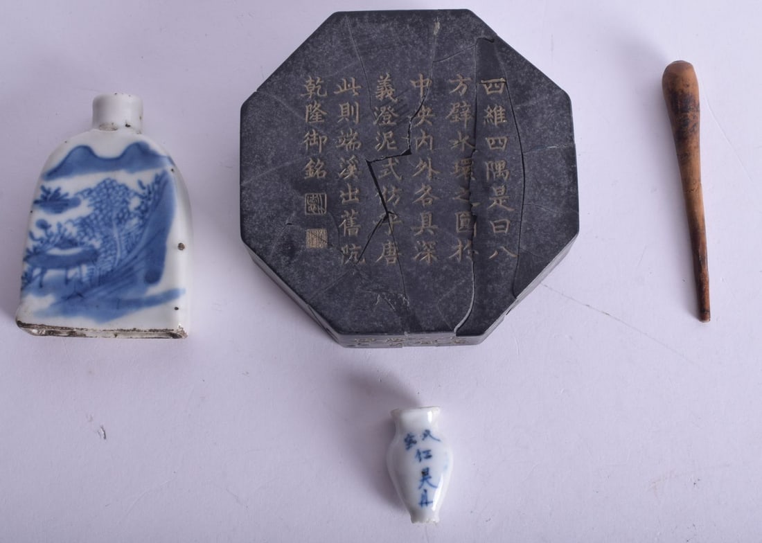 TWO 19TH CENTURY CHINESE BLUE AND WHITE PORCELAIN SNUFF BOTTLES together with an ink cake. (3) (1 of 3)