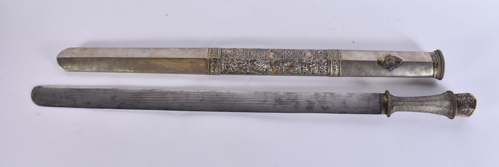 AN 18TH/19TH CENTURY TIBETAN SWORD with silver mounts and scabbard. 84 cm long.: AN 18TH/19TH CENTURY TIBETAN SWORD with silver mounts and scabbard. 84 cm long.